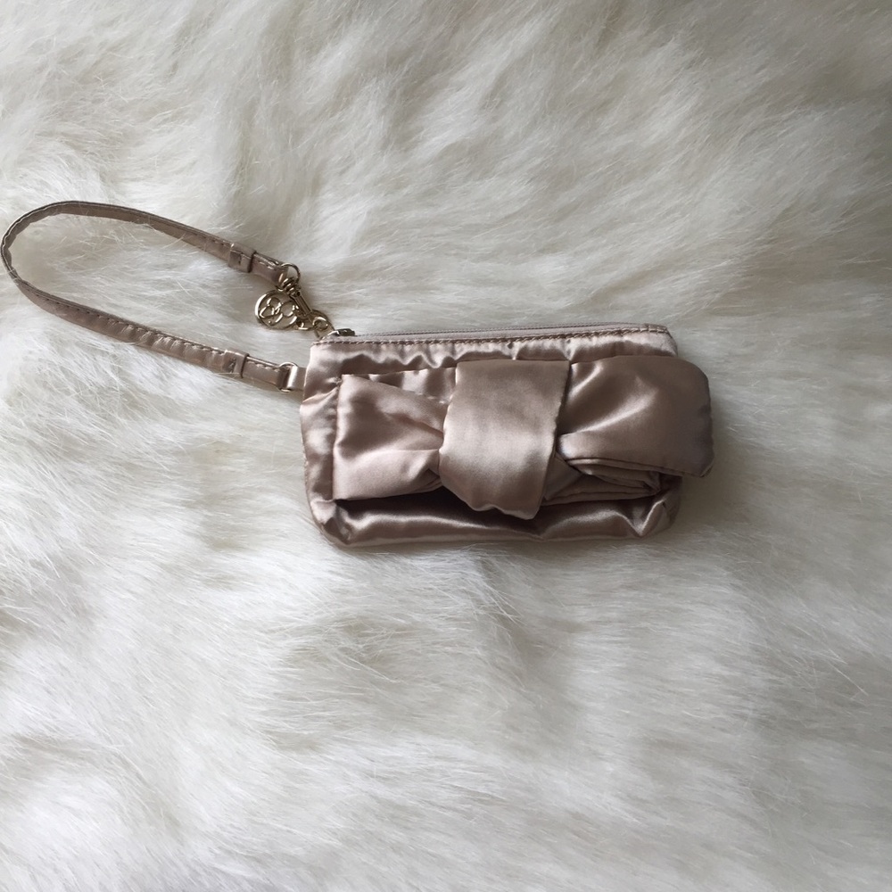 Mini Jessica Simpson gold wristlet.